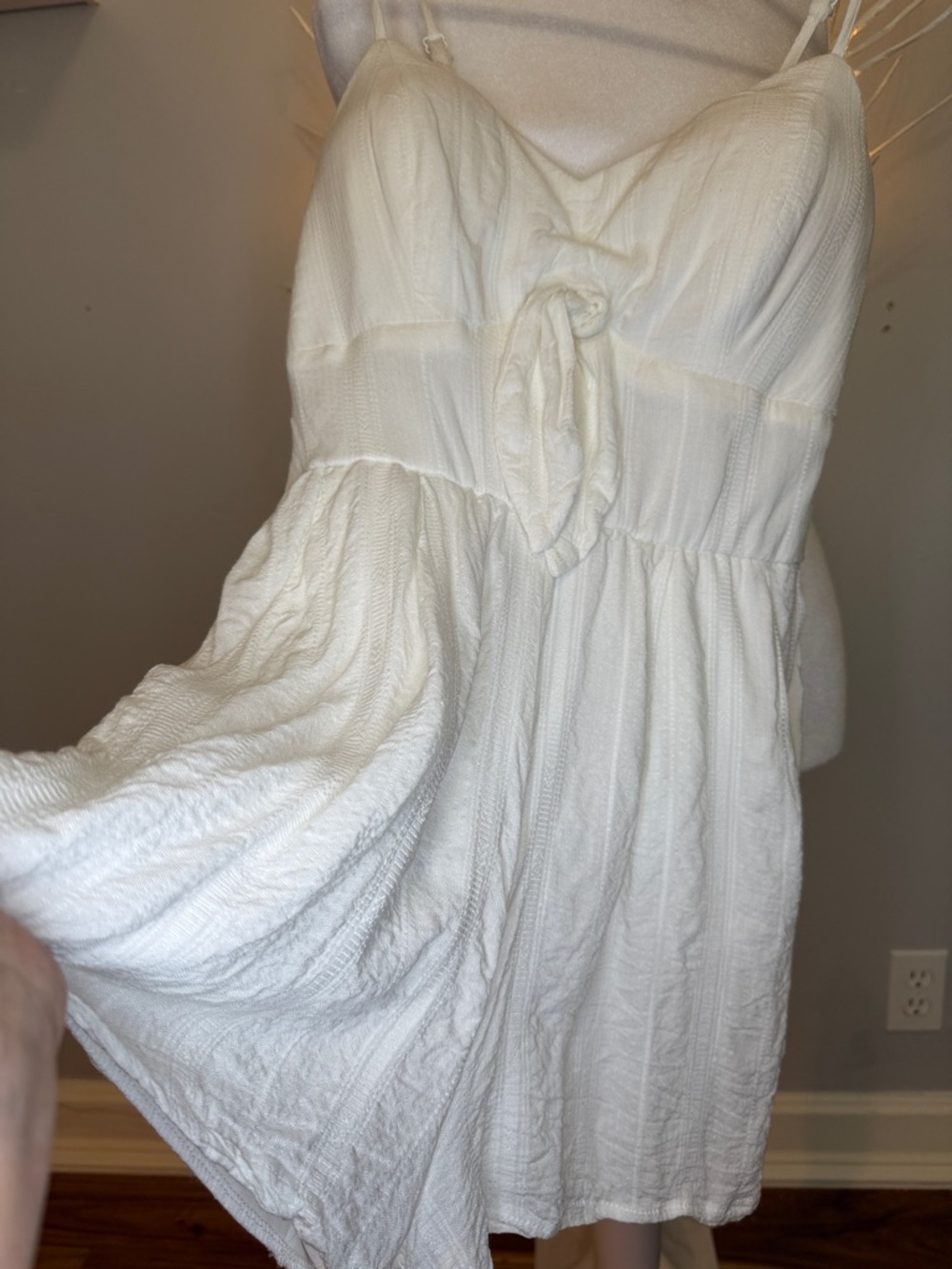 Romper gauze, like material,  adjustable straps and line at bottom legs